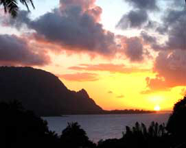 My beliefs helped me manifest a wonderful trip to Kuai. This is a picture of sunset over the bay and mountain.