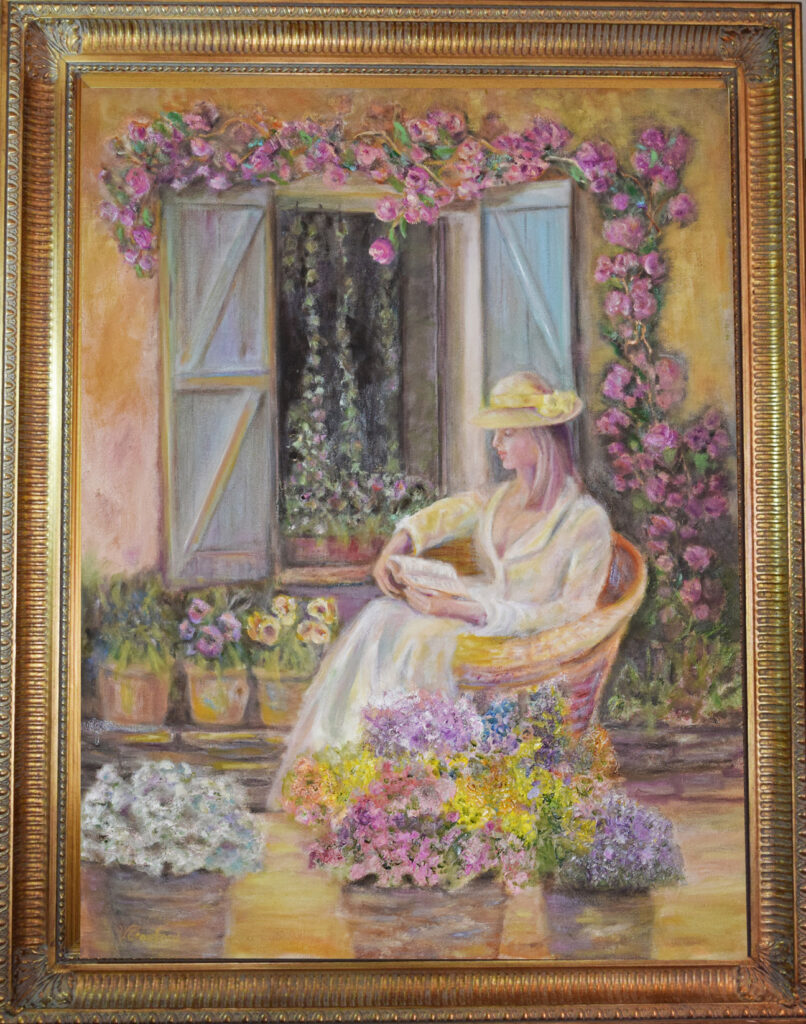 Summer in Provence by Verlaine Crawford. Oil painting. Girls setting on patio reading a book surrounded by flowers. Art with heart.