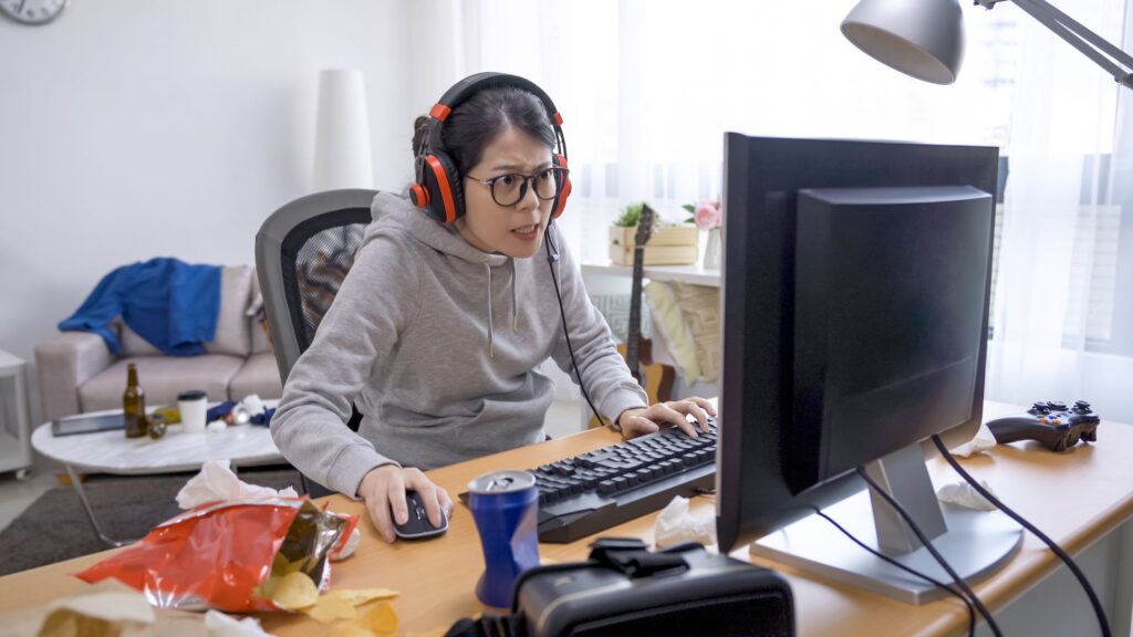 Woman becoming stressed while working at the computer. 